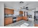 Charming kitchen with tile backsplash, dark appliances and breakfast bar at 341 Waterwheel Falls Dr, Henderson, NV 89015