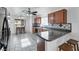 Well-lit kitchen with dark appliances, tile backsplash and backyard views at 341 Waterwheel Falls Dr, Henderson, NV 89015