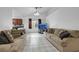 Inviting living room with tile flooring and comfortable couches at 341 Waterwheel Falls Dr, Henderson, NV 89015