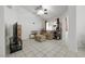 Bright living room with tile floors, a ceiling fan, and a large television at 341 Waterwheel Falls Dr, Henderson, NV 89015