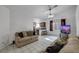 Open living room with views of the kitchen, tile flooring, and a cozy atmosphere at 341 Waterwheel Falls Dr, Henderson, NV 89015