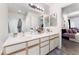 Bright bathroom featuring a double sink vanity and view into the bedroom at 3420 Winterhaven St # 202, Las Vegas, NV 89108