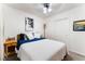 A cozy bedroom features neutral colors, a ceiling fan, and built-in closet doors at 3420 Winterhaven St # 202, Las Vegas, NV 89108