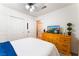 Bedroom featuring a dresser with TV, walk in closet, and ceiling fan at 3420 Winterhaven St # 202, Las Vegas, NV 89108