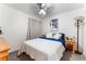 Bedroom with soft, natural light, featuring a wooden dresser and light gray walls at 3420 Winterhaven St # 202, Las Vegas, NV 89108