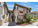 Condo buildings featuring staircases leading to upper units and desert landscaping at 3420 Winterhaven St # 202, Las Vegas, NV 89108