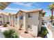 Exterior view of a two-story condominium with desert landscaping at 3420 Winterhaven St # 202, Las Vegas, NV 89108