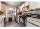 Kitchen with stainless steel appliances, wood-style floors, and white cabinets at 3420 Winterhaven St # 202, Las Vegas, NV 89108