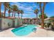 Inviting community pool and lounge area with palm trees at 3420 Winterhaven St # 202, Las Vegas, NV 89108