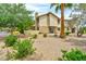 Green backyard with stucco siding and desert landscaping at 3484 Nightflower Ln # 2, Las Vegas, NV 89121