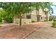 Green backyard with stucco siding and desert landscaping at 3484 Nightflower Ln # 2, Las Vegas, NV 89121