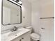 Bright bathroom featuring a framed mirror, sleek fixtures, and a coordinated sink and toilet set at 3484 Nightflower Ln # 2, Las Vegas, NV 89121