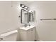 Well-lit bathroom featuring modern vanity with sink, updated mirror, and contemporary fixtures at 3484 Nightflower Ln # 2, Las Vegas, NV 89121