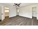 Bright bedroom showing new floors, ceiling fan, closet, and bathroom doors at 3484 Nightflower Ln # 2, Las Vegas, NV 89121