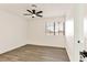 Cozy bedroom with ceiling fan, vinyl floors, and a window for natural light at 3484 Nightflower Ln # 2, Las Vegas, NV 89121