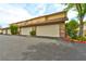 Attached garages of this townhome complex feature brick accents and a convenient parking area at 3484 Nightflower Ln # 2, Las Vegas, NV 89121