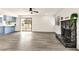 Open living area with fireplace and newly remodeled kitchen with blue cabinets at 3484 Nightflower Ln # 2, Las Vegas, NV 89121
