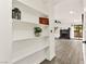 Inviting living room with fireplace, wood-look floors, and charming built-in shelving accents at 3484 Nightflower Ln # 2, Las Vegas, NV 89121