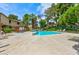 Sparkling community pool surrounded by lush greenery and comfortable lounge chairs at 3484 Nightflower Ln # 2, Las Vegas, NV 89121