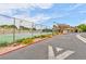 Community tennis court with lush landscaping offering residents recreational opportunities at 3484 Nightflower Ln # 2, Las Vegas, NV 89121