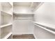 Walk-in closet with built in shelving for optimal storage of clothing and personal items at 3484 Nightflower Ln # 2, Las Vegas, NV 89121