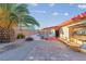 Inviting backyard with a sparkling pool, lush palm trees, and ample seating area at 3625 Barcelona St, Las Vegas, NV 89121