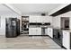 Bright kitchen features stainless steel appliances, white cabinets, and modern countertops at 3625 Barcelona St, Las Vegas, NV 89121