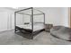 Main bedroom features a four-poster bed frame and comfortable carpet floors at 3625 Barcelona St, Las Vegas, NV 89121