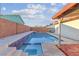 Beautiful swimming pool with spa, surrounded by tiled accents and privacy wall at 3625 Barcelona St, Las Vegas, NV 89121