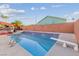 Swimming pool featuring diving board and steps, perfect for outdoor recreation at 3625 Barcelona St, Las Vegas, NV 89121
