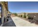 Spacious backyard with a concrete patio and desert landscaping with serene mountain views at 3642 Winter Whitetail St, Las Vegas, NV 89122
