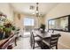 Cozy dining area with stylish decor, sliding door access to the backyard, and natural light at 3642 Winter Whitetail St, Las Vegas, NV 89122