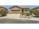 Charming single-story home featuring a well-maintained front yard with desert landscaping and an attached garage at 3642 Winter Whitetail St, Las Vegas, NV 89122