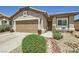 Lovely single-story home featuring desert landscaping, an attached garage and front patio seating area at 3642 Winter Whitetail St, Las Vegas, NV 89122