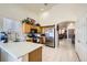 Bright kitchen featuring stainless steel appliances, wood cabinetry, and ample counter space for meal preparation at 3642 Winter Whitetail St, Las Vegas, NV 89122