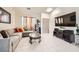 Comfortable living room with tile flooring, ample seating and a media center for relaxed entertainment at 3642 Winter Whitetail St, Las Vegas, NV 89122
