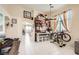 Open-concept area featuring a workstation, dining area, and exercise equipment at 3642 Winter Whitetail St, Las Vegas, NV 89122
