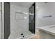 Modern bathroom with a glass-enclosed shower and elegant tile work at 3986 Belleville Ave, Las Vegas, NV 89121
