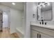 Bathroom featuring modern fixtures, a vanity with sink, and a shower-tub combination at 3986 Belleville Ave, Las Vegas, NV 89121