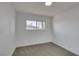 Bedroom with neutral carpet, white walls and a window, offering a serene space at 3986 Belleville Ave, Las Vegas, NV 89121