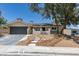Charming home with a well-manicured front yard and a two-car garage at 3986 Belleville Ave, Las Vegas, NV 89121