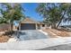 Well-maintained home featuring a spacious driveway and desert-style landscaping at 3986 Belleville Ave, Las Vegas, NV 89121