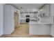 Updated kitchen featuring white cabinets, stainless steel appliances, and a breakfast bar at 3986 Belleville Ave, Las Vegas, NV 89121