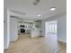 Stylish kitchen featuring white cabinets, quartz countertops, and stainless steel appliances at 3986 Belleville Ave, Las Vegas, NV 89121