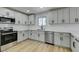 Contemporary kitchen featuring white cabinets, stainless steel appliances, and white countertops at 3986 Belleville Ave, Las Vegas, NV 89121