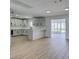Bright, open kitchen with white cabinets, breakfast bar, and stainless steel appliances at 3986 Belleville Ave, Las Vegas, NV 89121