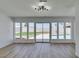 Bright living room area with large windows and access to the backyard pool and patio at 3986 Belleville Ave, Las Vegas, NV 89121