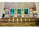 Elegant bar with a row of chairs and a unique aquarium display behind the counter at 4381 W Flamingo Rd # 2220, Las Vegas, NV 89103