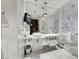 Modern bathroom features dual sinks, a luxurious shower, with contemporary fixtures, and a mounted TV at 4381 W Flamingo Rd # 2220, Las Vegas, NV 89103