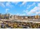 City view showcasing the iconic Las Vegas skyline, featuring several prominent hotels and resorts against a backdrop of blue sky and clouds at 4381 W Flamingo Rd # 2220, Las Vegas, NV 89103